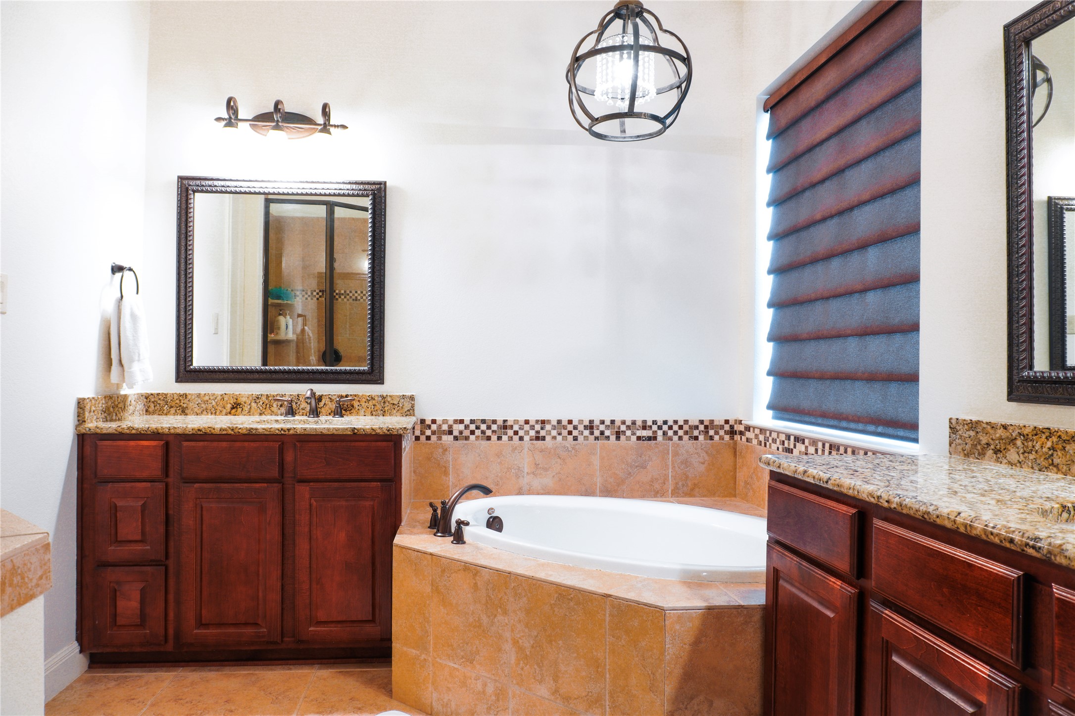 102 Indigo Run Cove Austin, TX 78738 - Photo 11 of 24 Full bathroom with a garden tub and two vanities