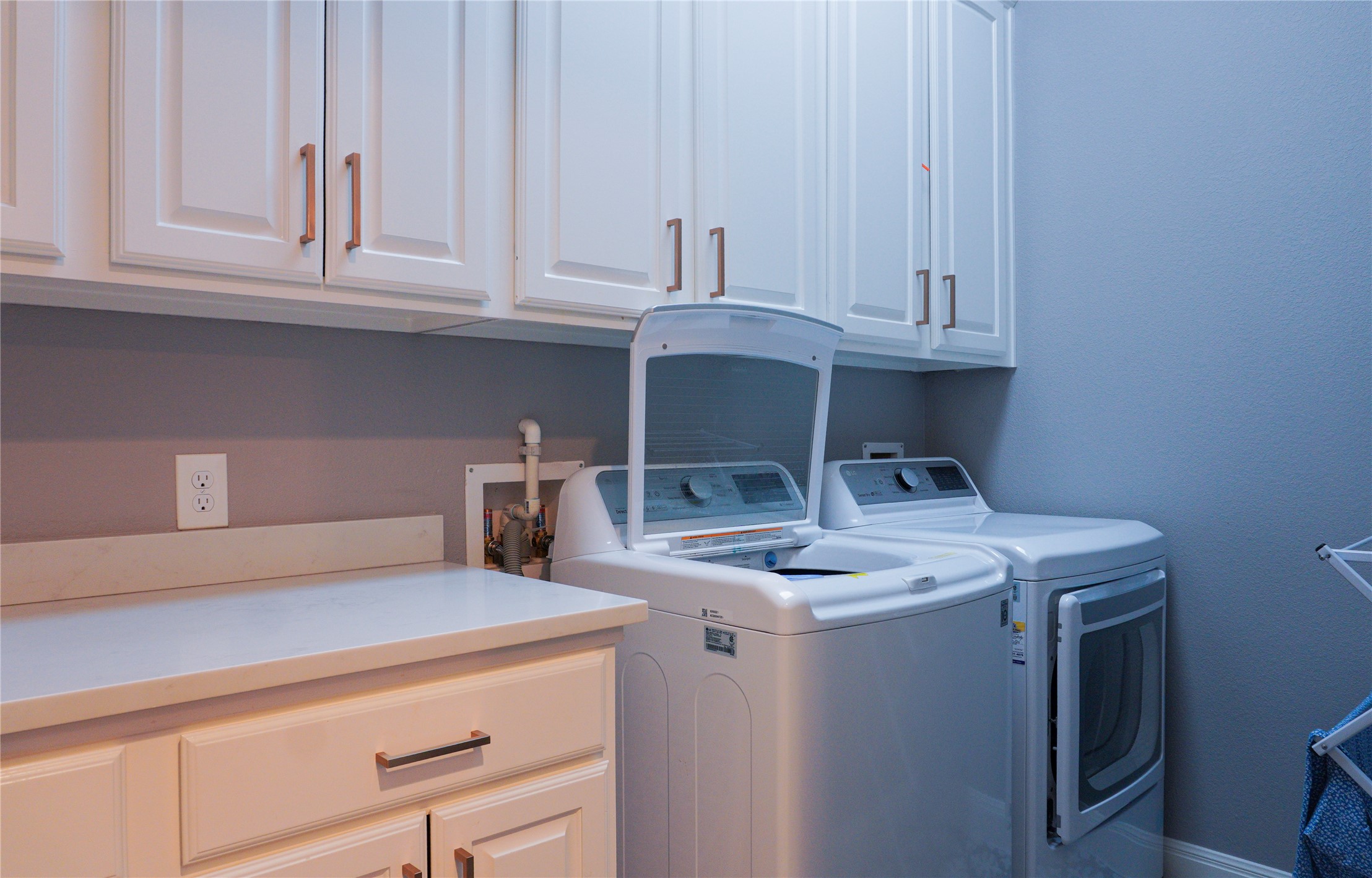 102 Indigo Run Cove Austin, TX 78738 - Photo 13 of 24 Laundry room featuring cabinet space and washing machine and dryer