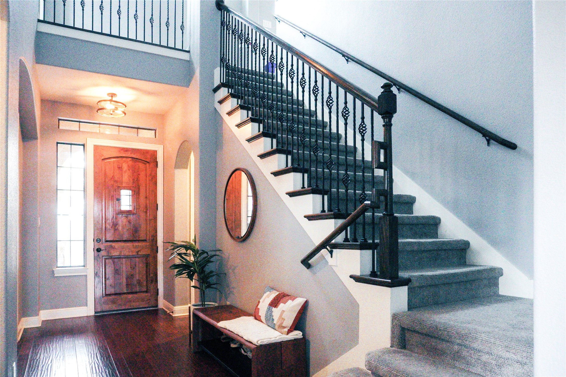 102 Indigo Run Cove Austin, TX 78738 - Photo 15 of 24 Foyer featuring arched walkways and dark wood finished floors