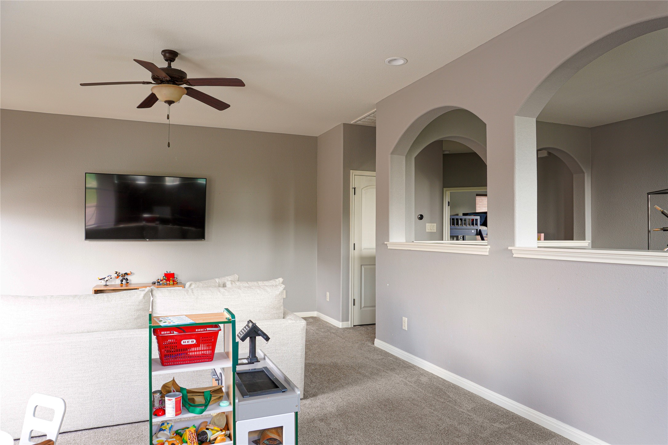 102 Indigo Run Cove Austin, TX 78738 - Photo 16 of 24 Recreation room featuring ceiling fan and carpet floors