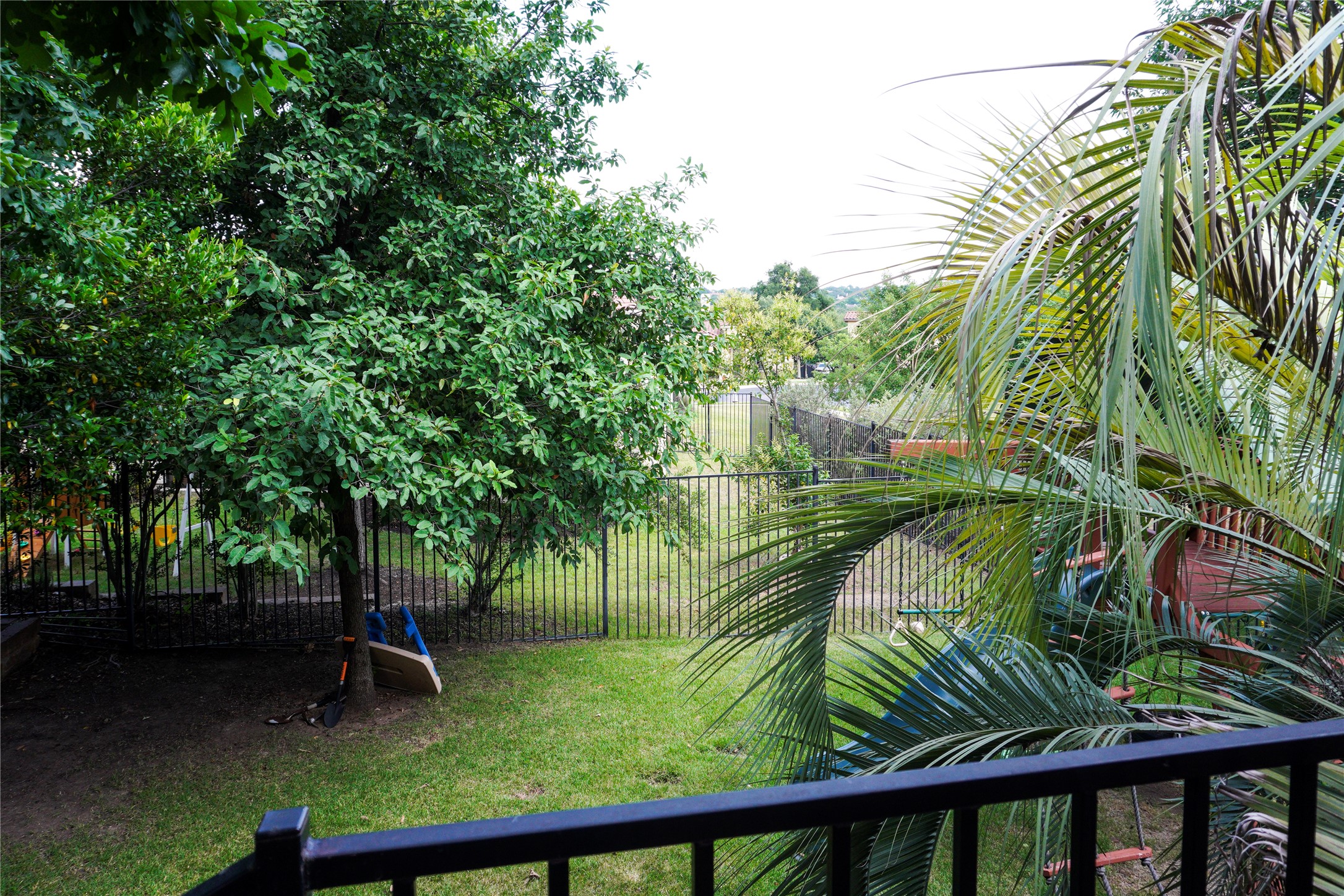 102 Indigo Run Cove Austin, TX 78738 - Photo 22 of 24 Fenced backyard featuring a balcony