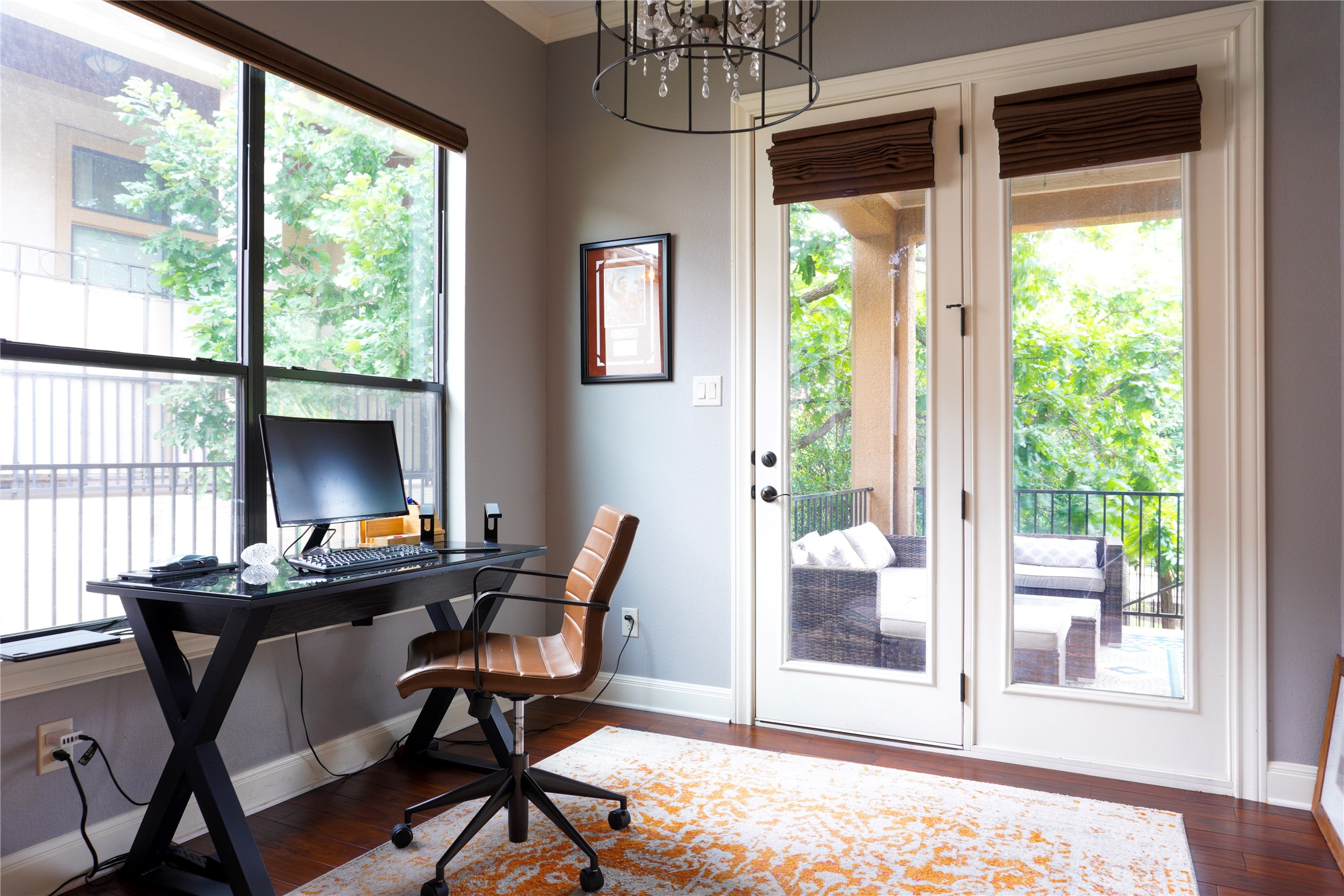 102 Indigo Run Cove Austin, TX 78738 - Photo 10 of 24 Office with hanging lights, plenty of natural light, and dark wood-style floors