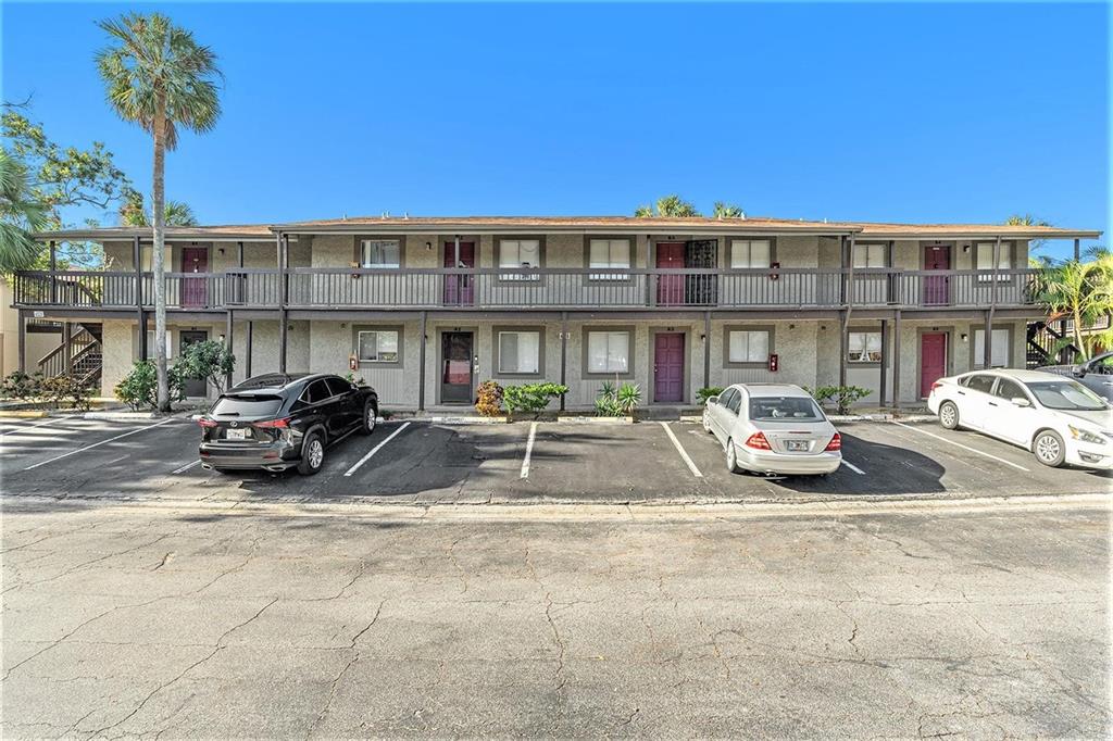 a view of a car parked in front of a building