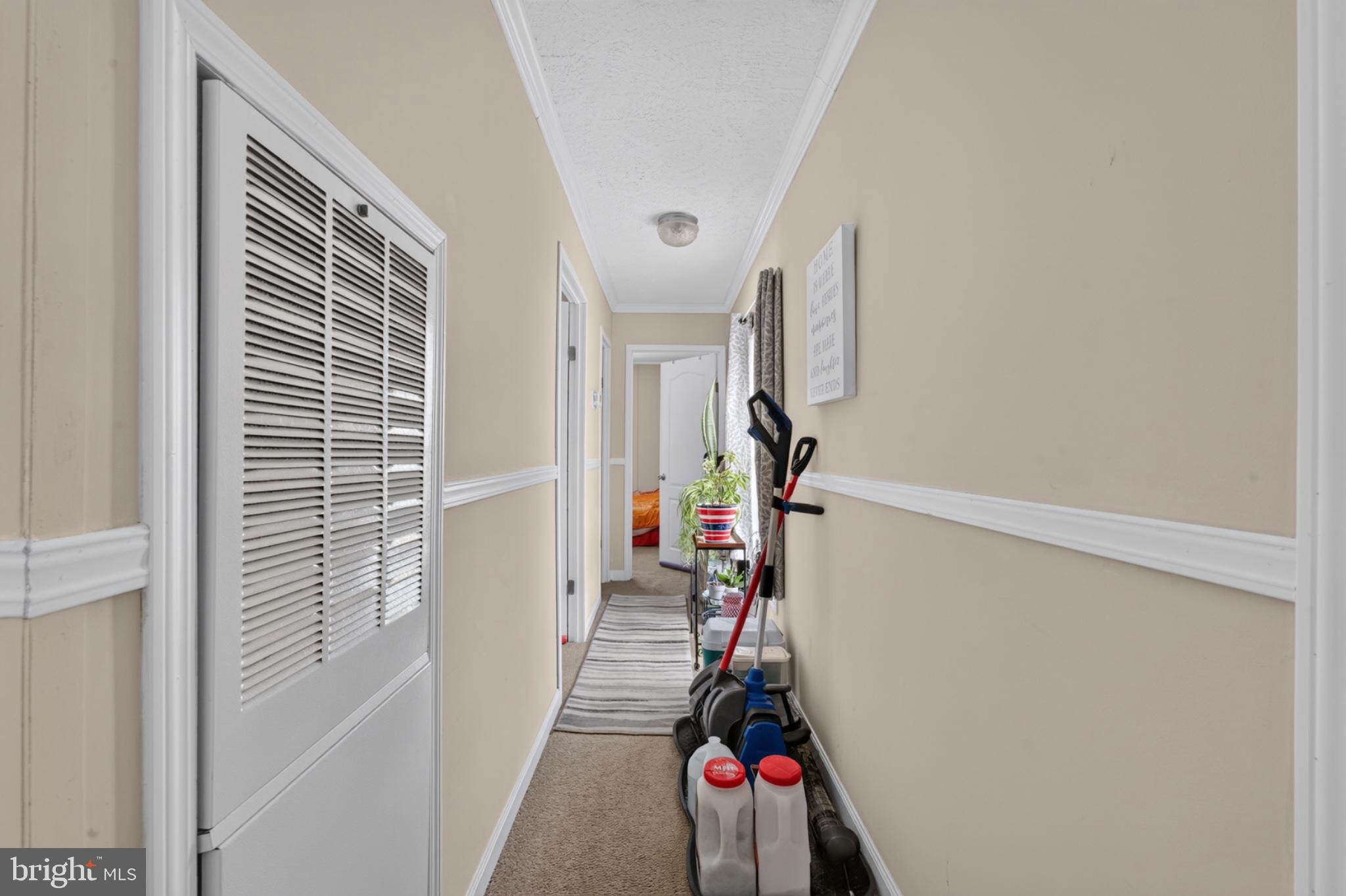 412 Ranee Loop Bear, DE 19701 - Photo 21 of 24 Inviting hallway with warm tones.