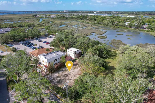 an aerial view of a house with a swimming pool yard and outdoor seating