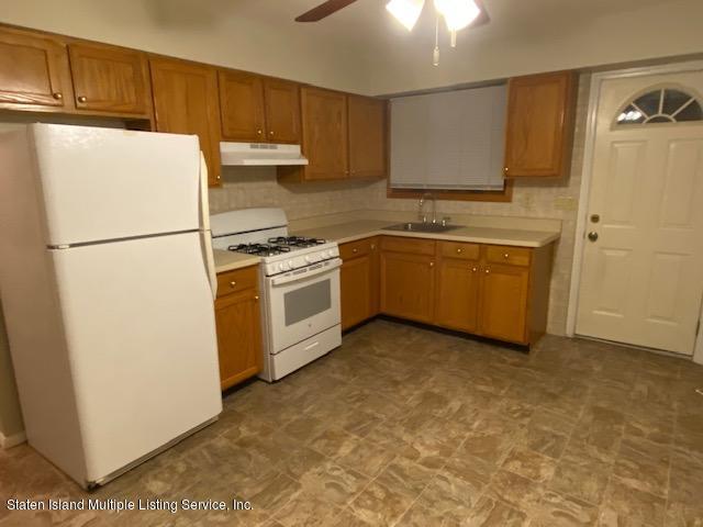 a kitchen with stainless steel appliances granite countertop a refrigerator a stove a sink dishwasher and a refrigerator