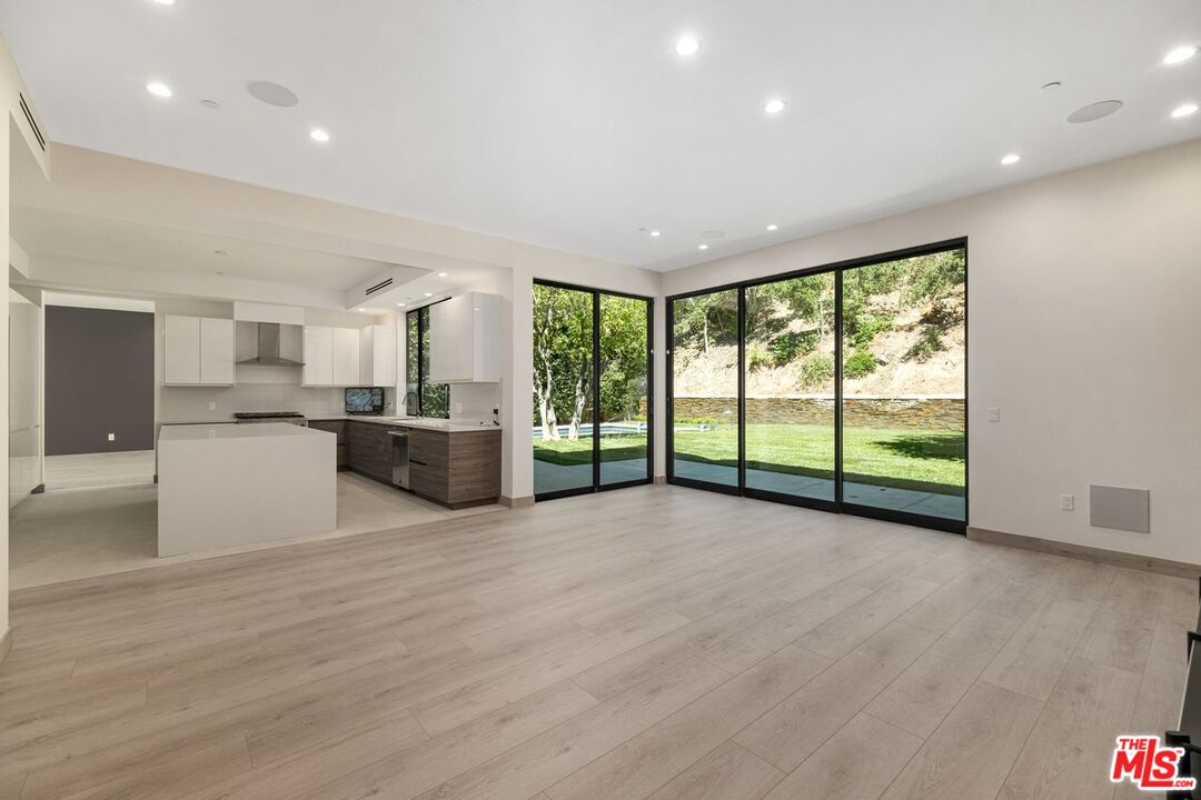 9719 Blantyre Drive Beverly Hills, CA 90210 - Photo 20 of 43 a view of a big room with windows and kitchen view