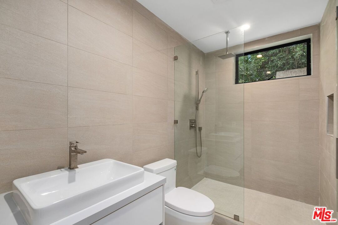 9719 Blantyre Drive Beverly Hills, CA 90210 - Photo 22 of 43 a bathroom with a sink toilet and shower