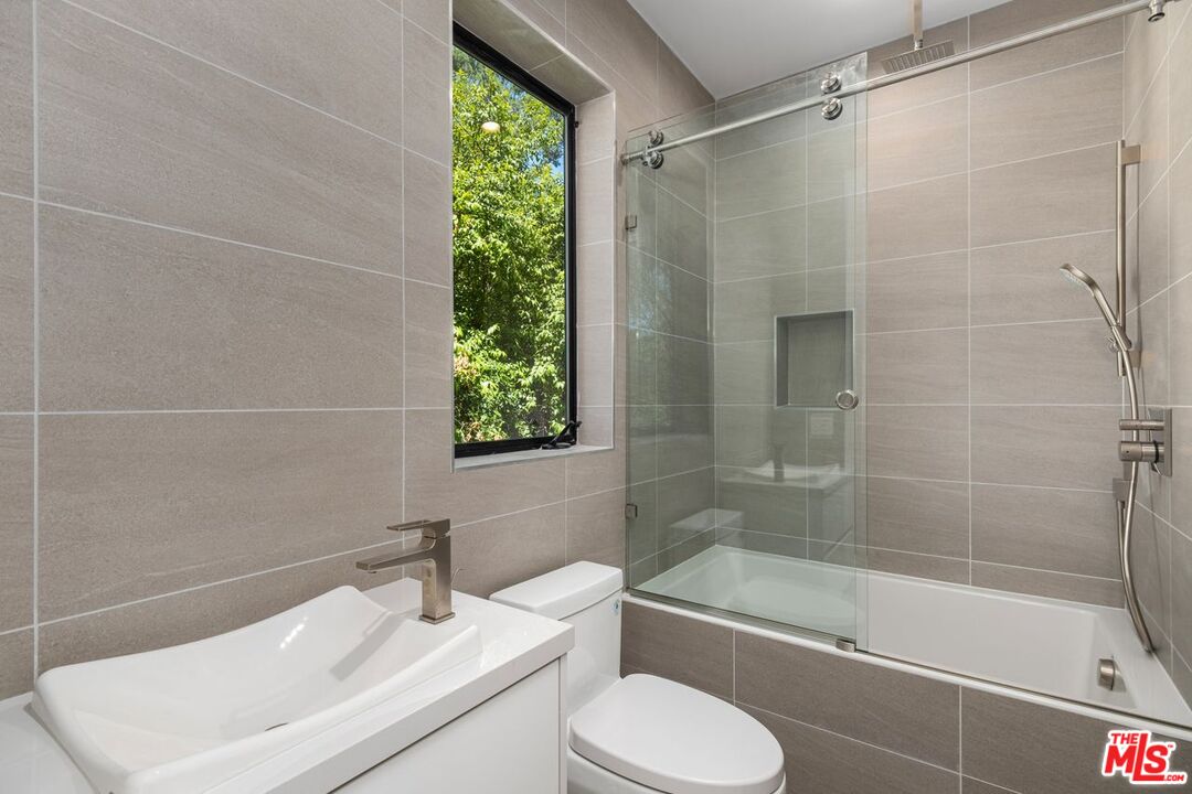 9719 Blantyre Drive Beverly Hills, CA 90210 - Photo 29 of 43 a bathroom with a sink toilet and shower