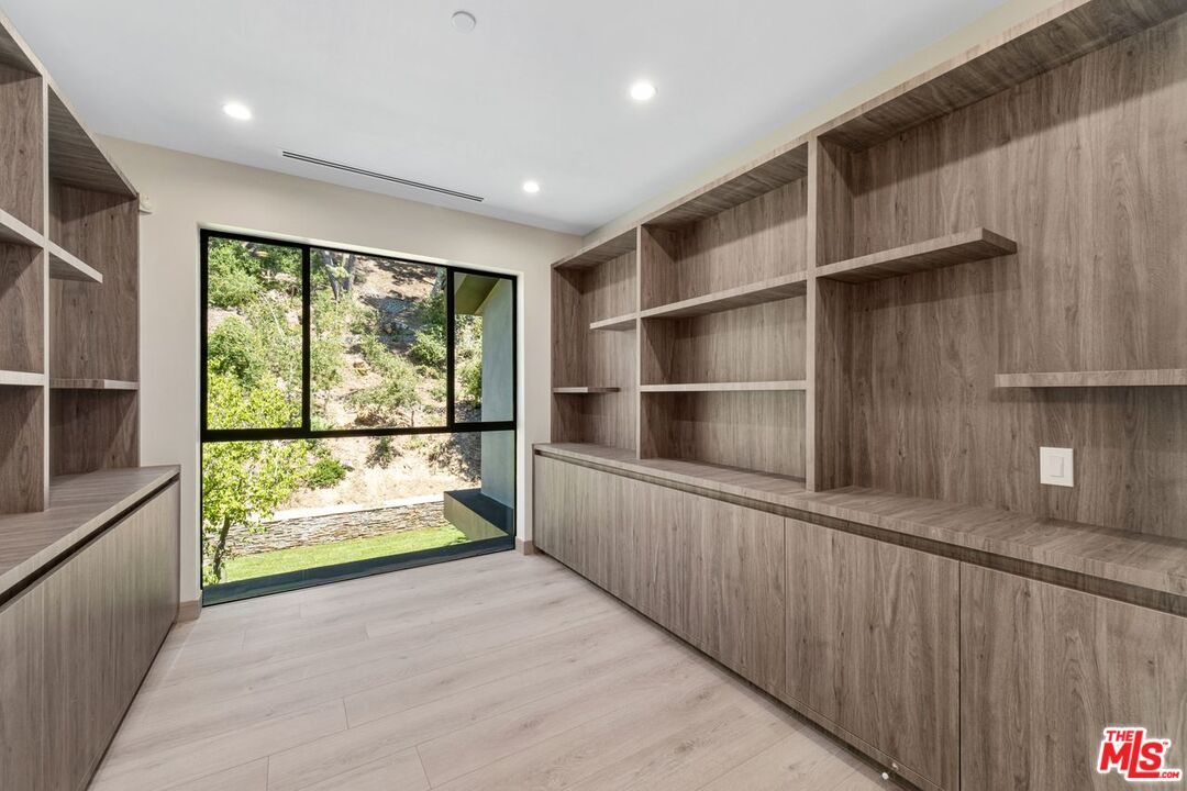 9719 Blantyre Drive Beverly Hills, CA 90210 - Photo 32 of 43 a view of an empty room with a window