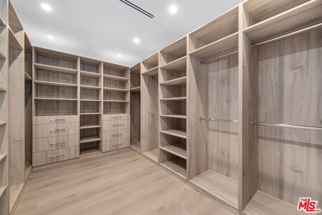 9719 Blantyre Drive Beverly Hills, CA 90210 - Photo 35 of 43 a view of walk in closet with empty racks