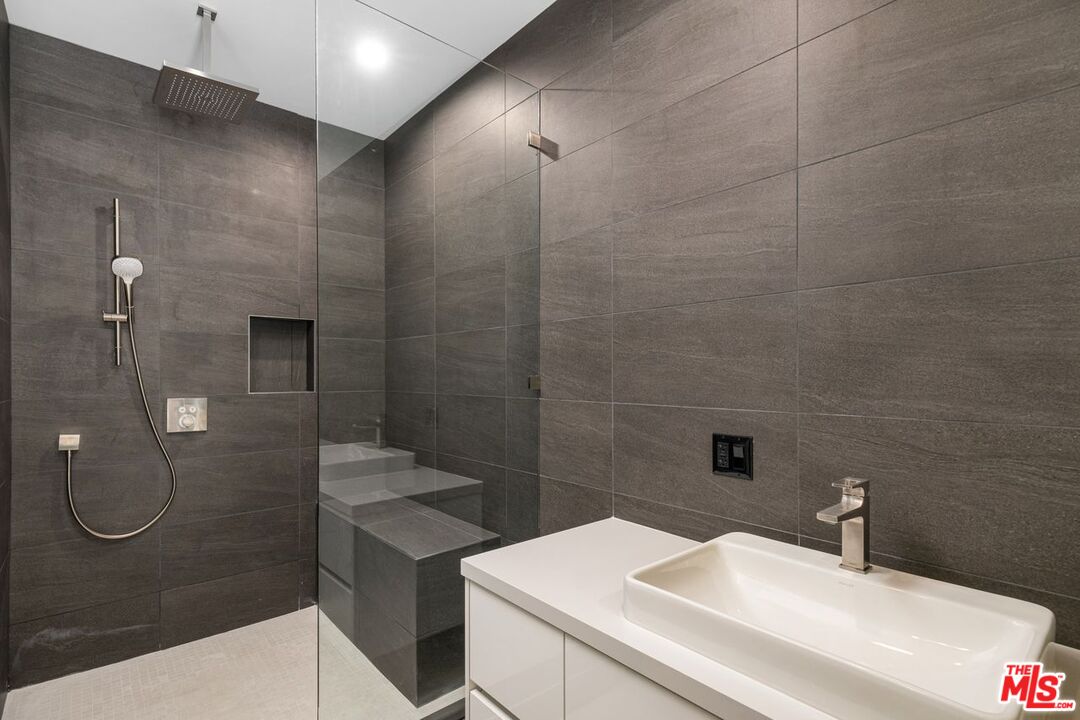 9719 Blantyre Drive Beverly Hills, CA 90210 - Photo 37 of 43 a bathroom with a sink a toilet and shower