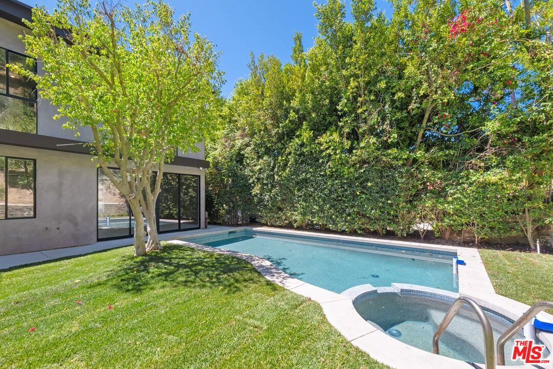 9719 Blantyre Drive Beverly Hills, CA 90210 - Photo 43 of 43 a view of a swimming pool with a patio