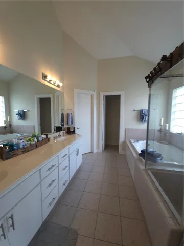 a large bathroom with a lot of counter space and a sink