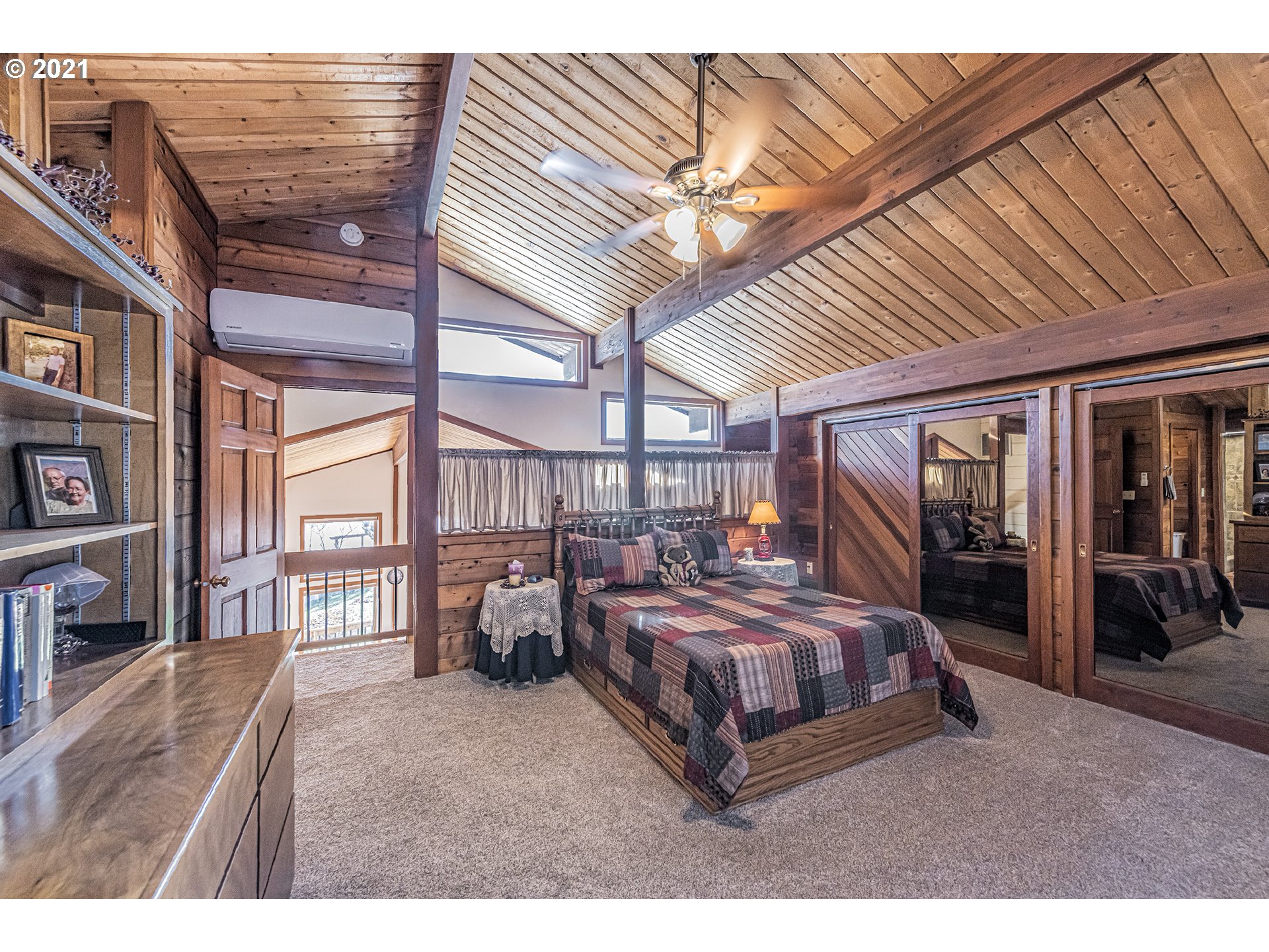 81876 Gerking Flat Road Athena, OR 97813 - Photo 13 of 30 a bedroom with a large bed and a chandelier