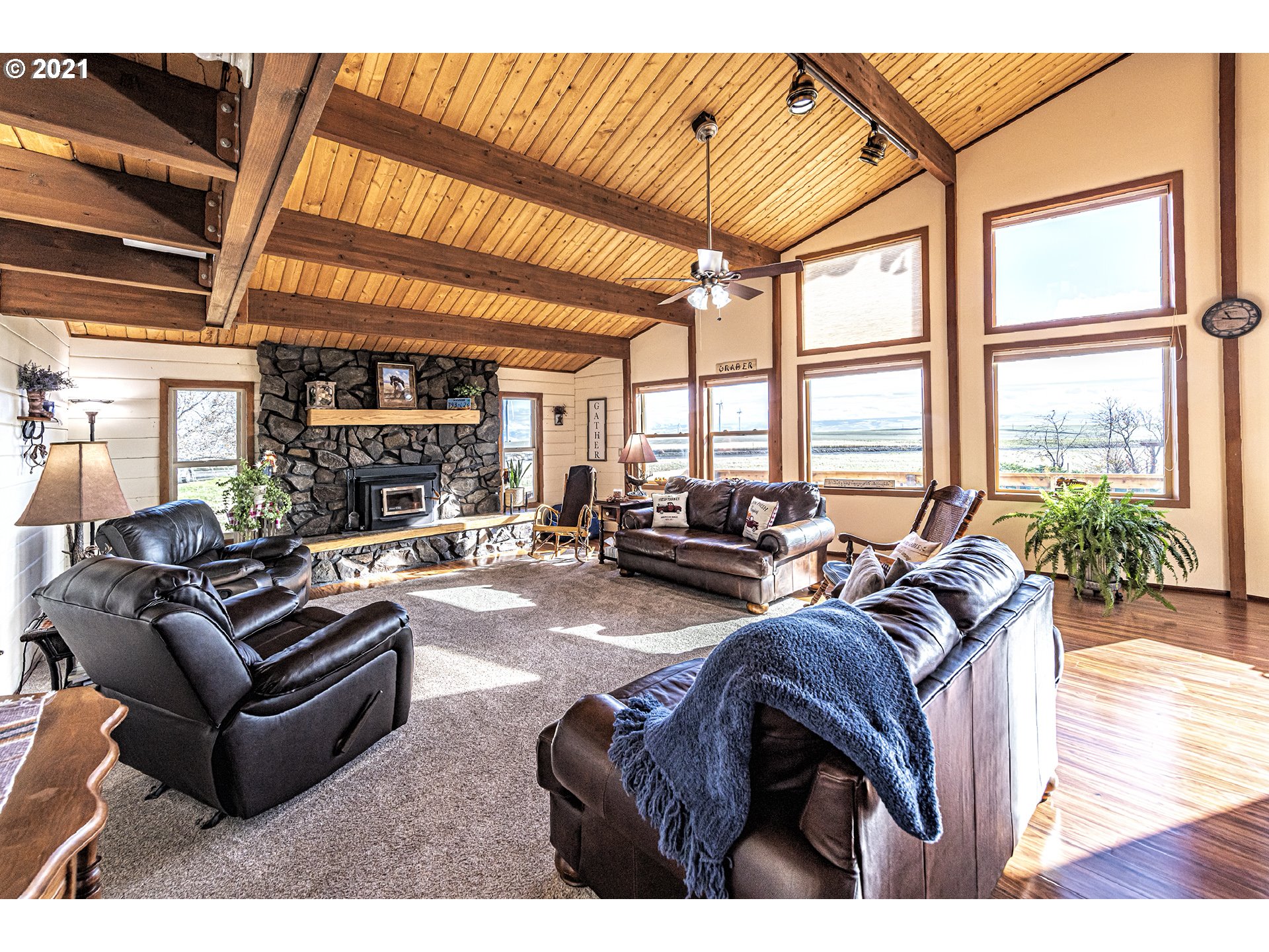 81876 Gerking Flat Road Athena, OR 97813 - Photo 6 of 30 a living room with furniture large windows and wooden floor