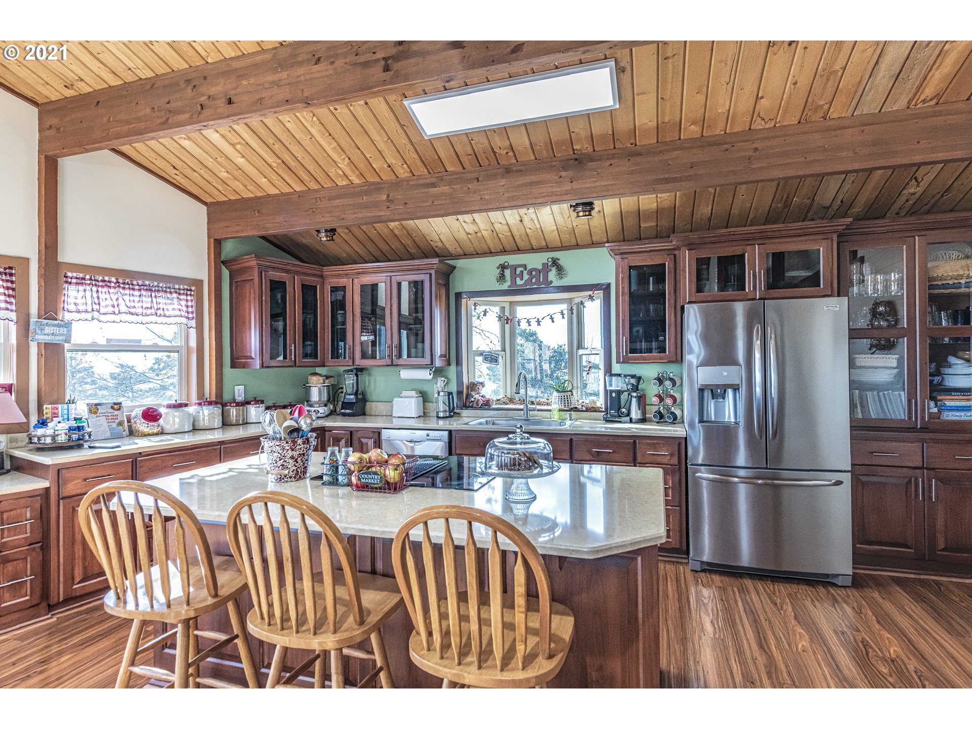81876 Gerking Flat Road Athena, OR 97813 - Photo 8 of 30 a dining room with furniture a chandelier and wooden floor