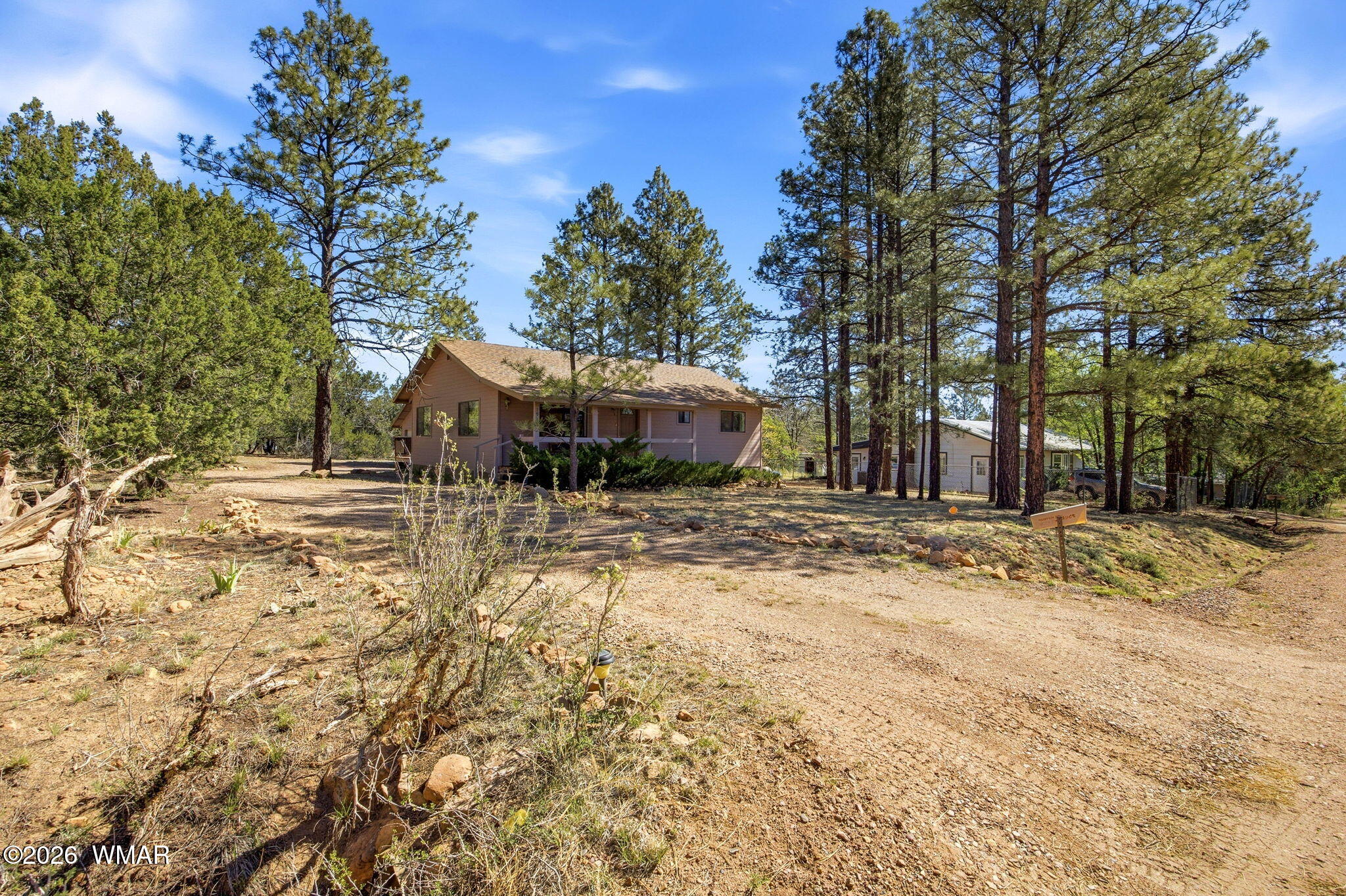 1924 Little Doe Trail Overgaard, AZ 85933 - Photo 1 of 31 a backyard of a house with oven and tree