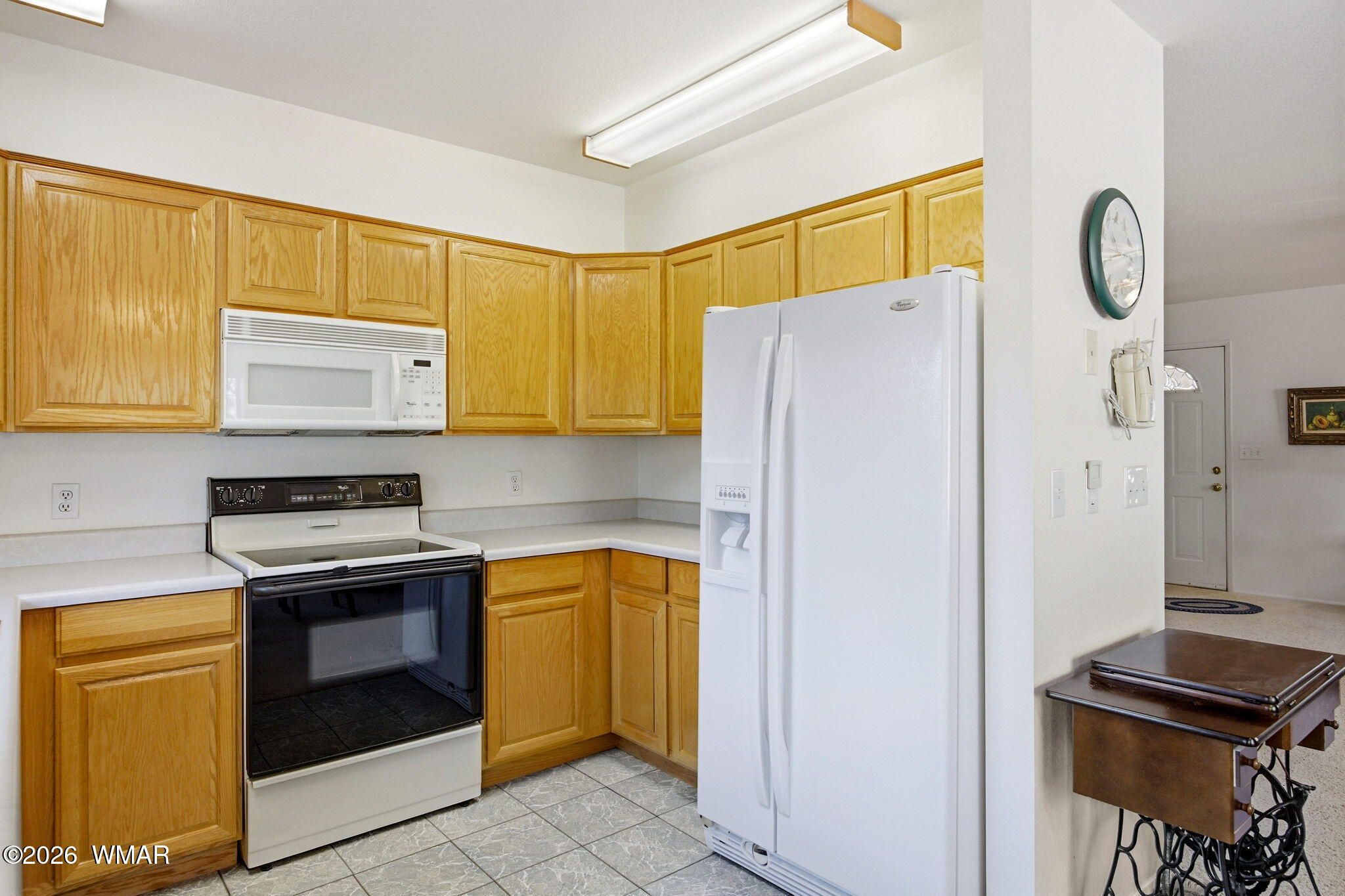 1924 Little Doe Trail Overgaard, AZ 85933 - Photo 11 of 31 a kitchen with a refrigerator and a stove top oven
