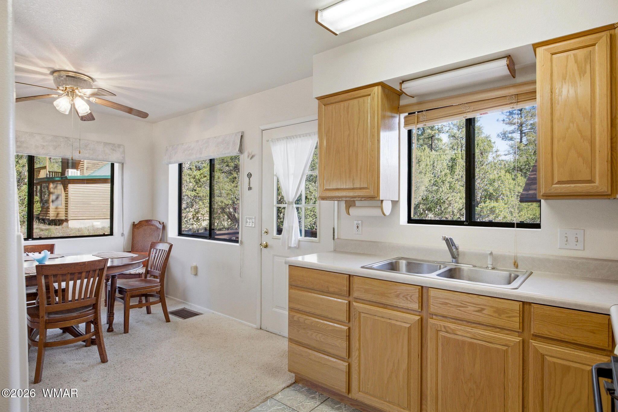 1924 Little Doe Trail Overgaard, AZ 85933 - Photo 13 of 31 a spacious bathroom with a granite countertop sink and a window