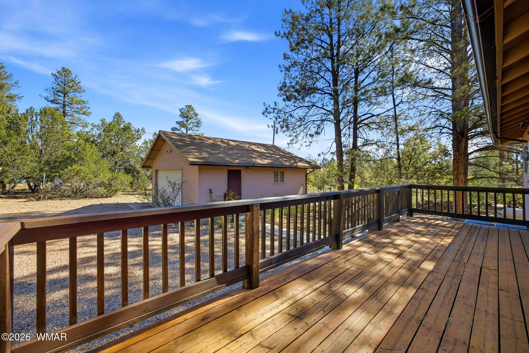 1924 Little Doe Trail Overgaard, AZ 85933 - Photo 23 of 31 a view of a wooden deck with a trees