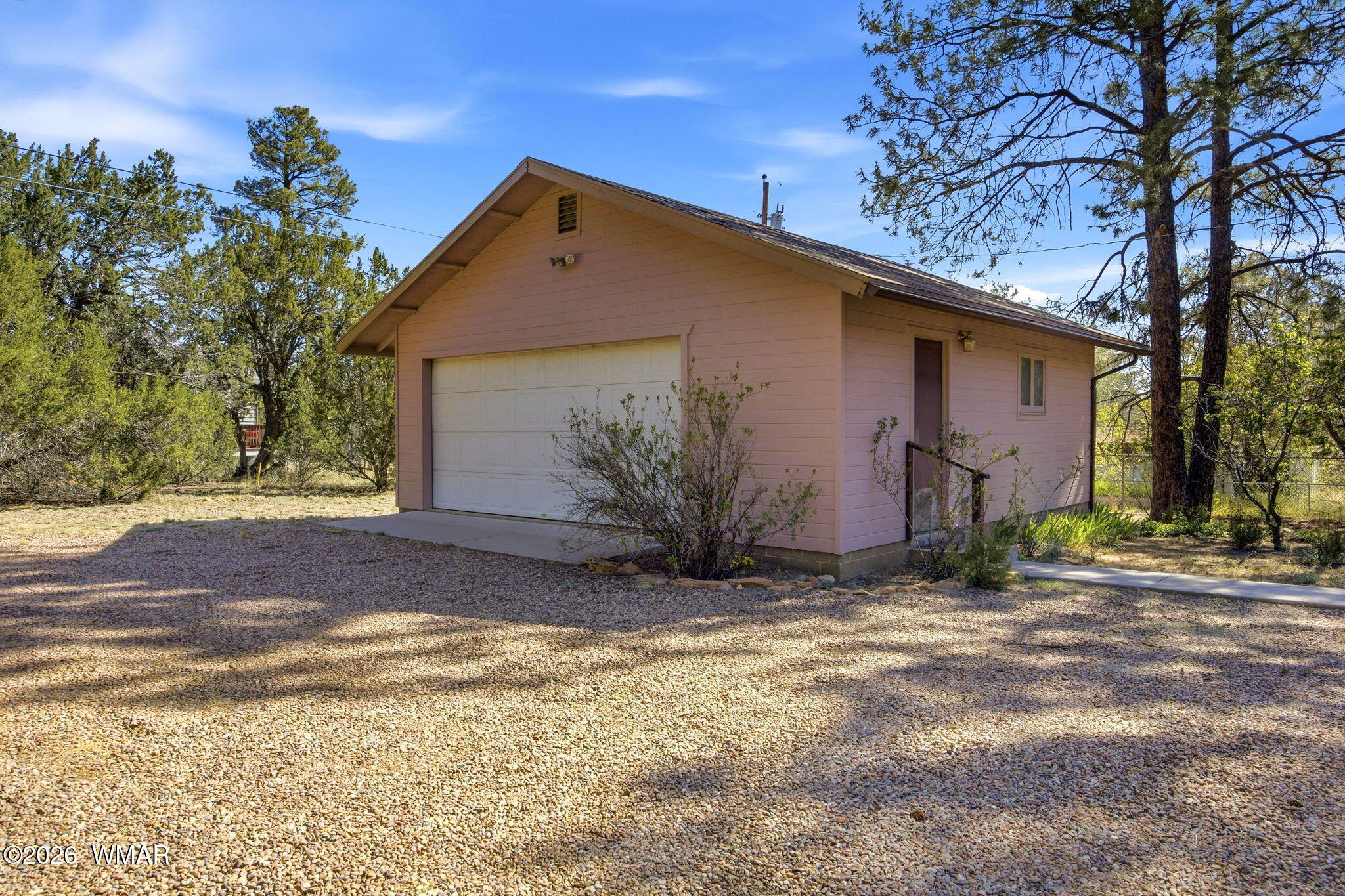 1924 Little Doe Trail Overgaard, AZ 85933 - Photo 26 of 31 a front view of a house with a yard
