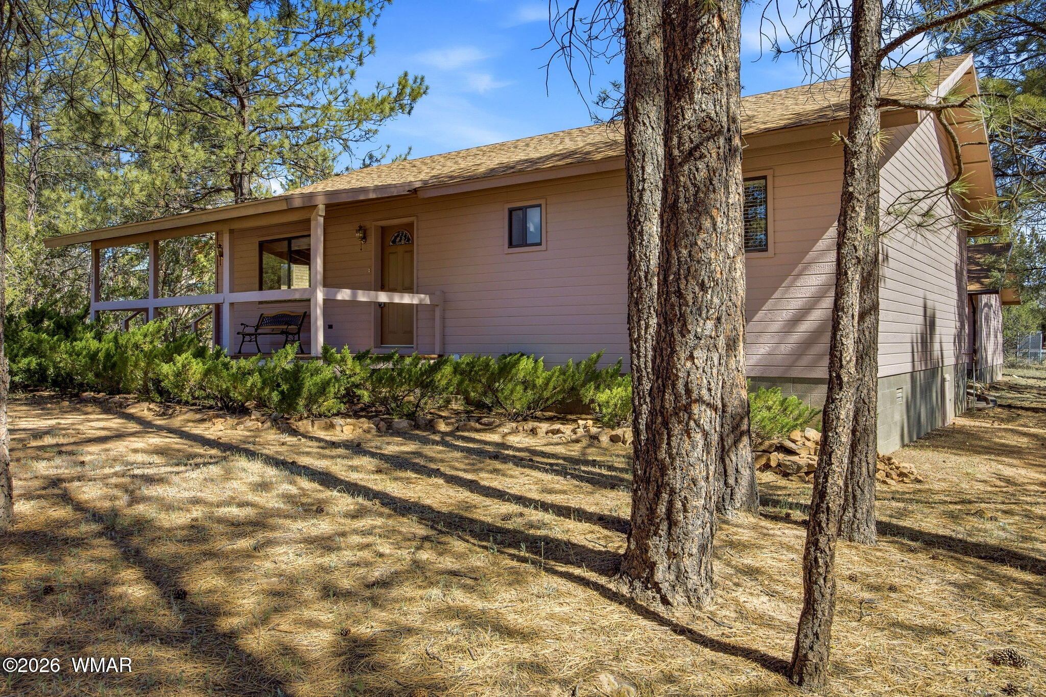 1924 Little Doe Trail Overgaard, AZ 85933 - Photo 4 of 31 a front view of a house with garden