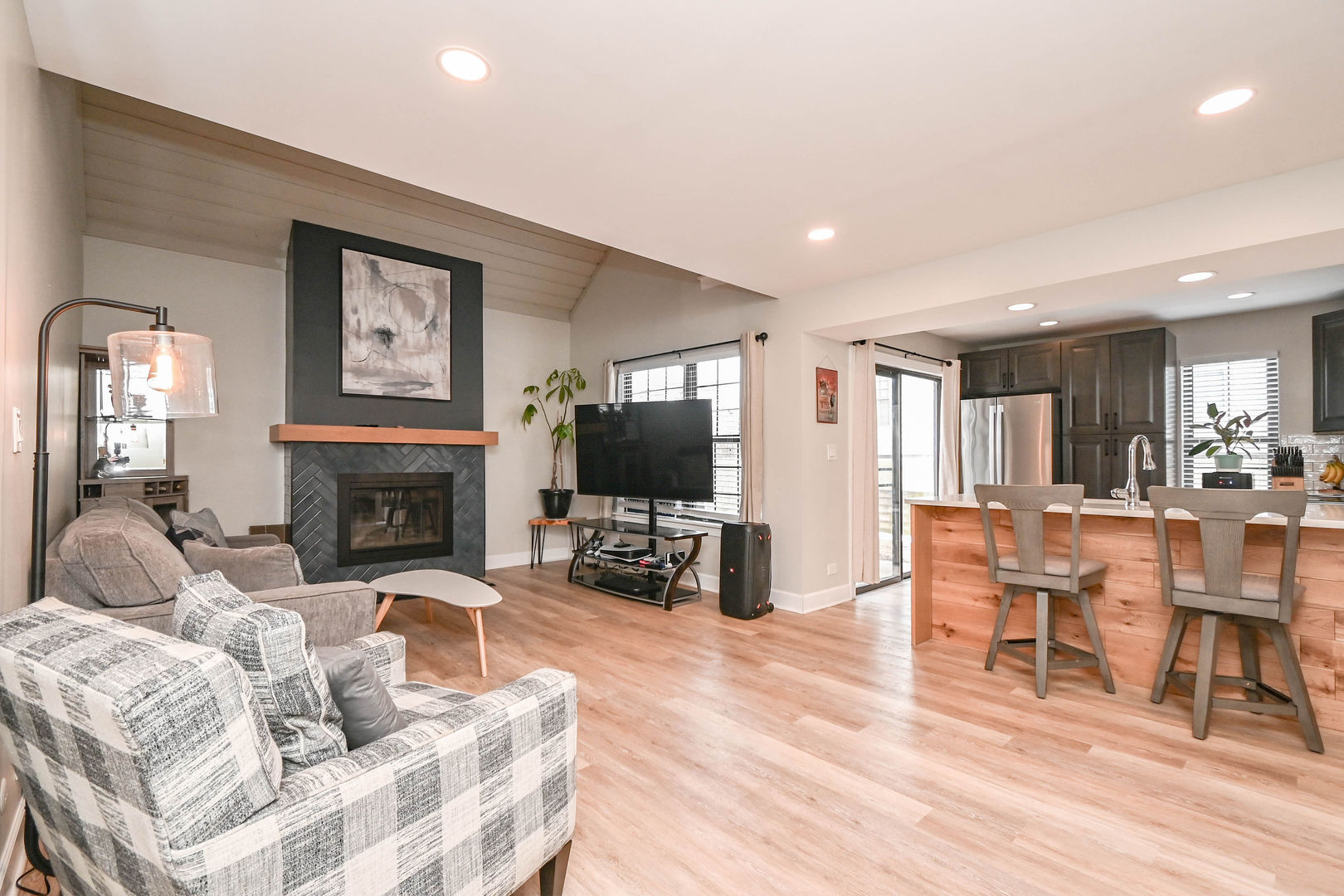 598 Dunham Road Gurnee, IL 60031 - Photo 13 of 31 a living room with furniture a fireplace and a flat screen tv