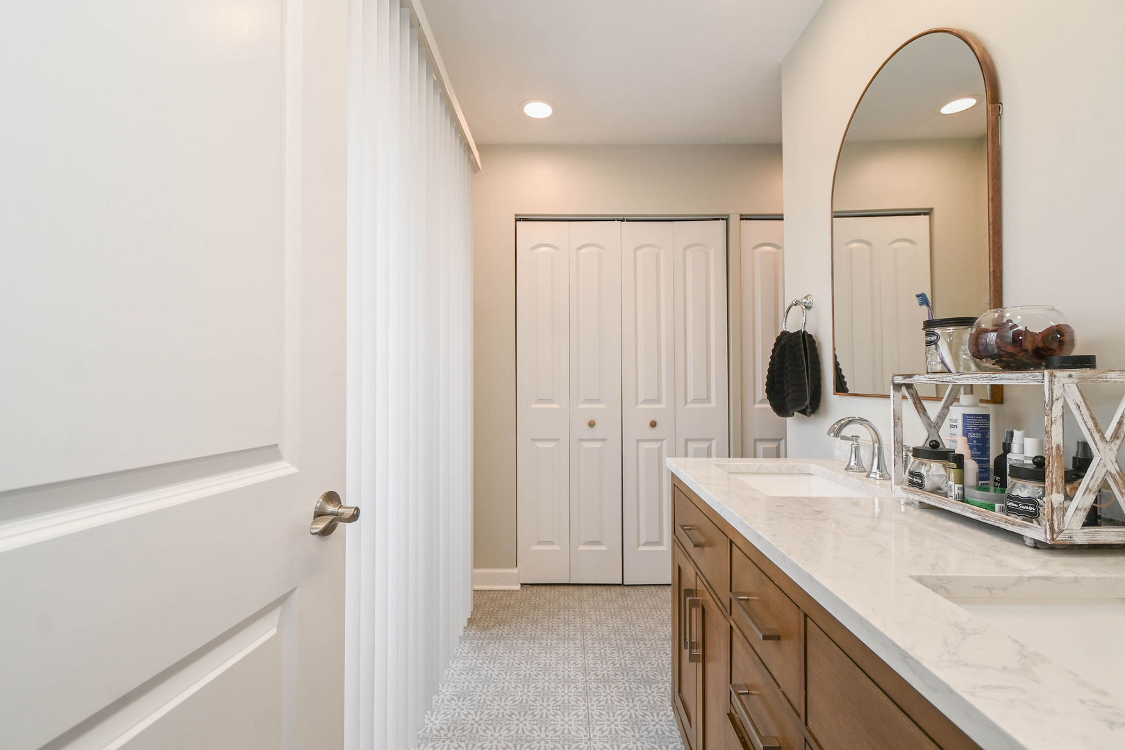 598 Dunham Road Gurnee, IL 60031 - Photo 18 of 31 a bathroom with a double vanity sink and a mirror