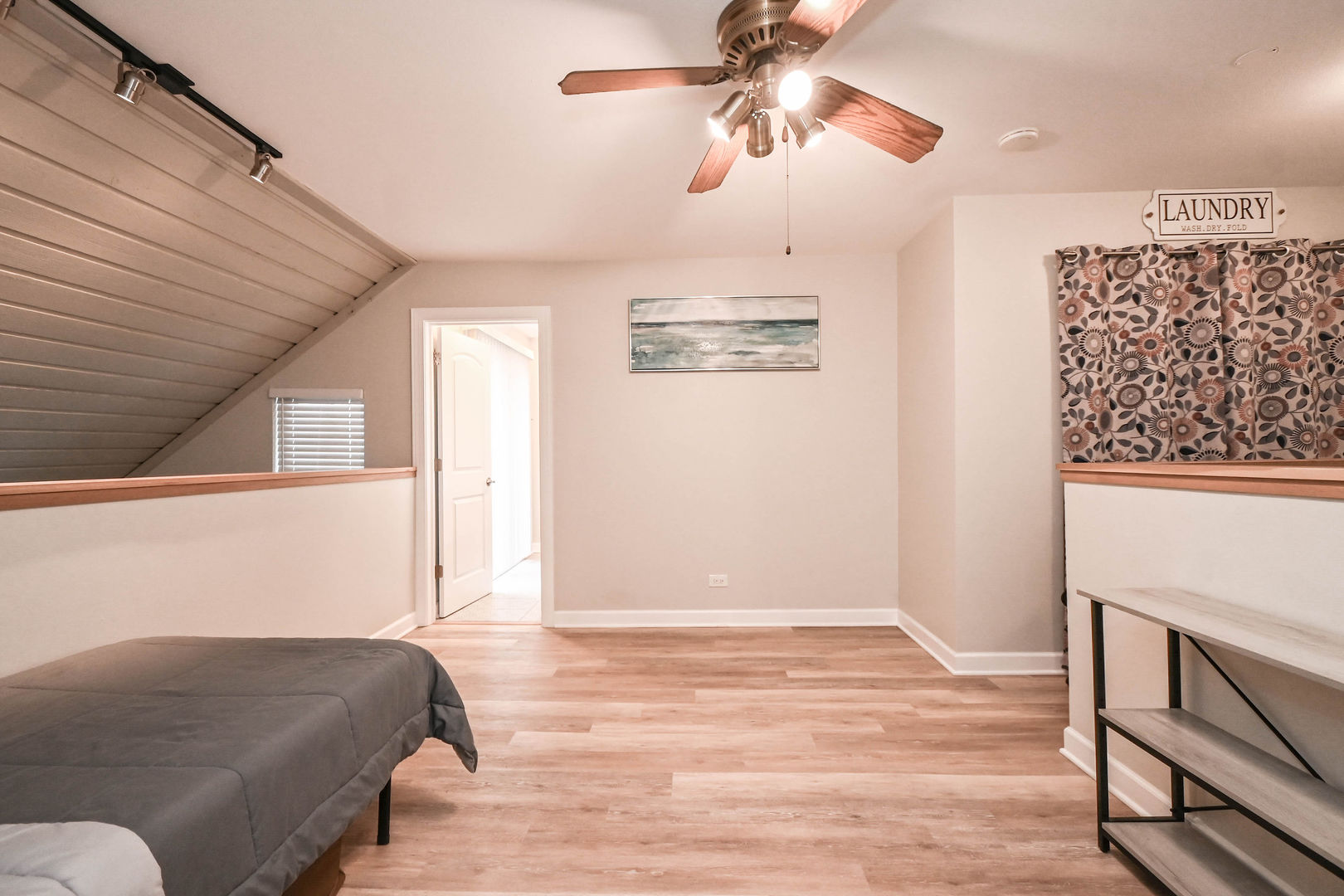 598 Dunham Road Gurnee, IL 60031 - Photo 24 of 31 a bedroom with a bed and a chandelier