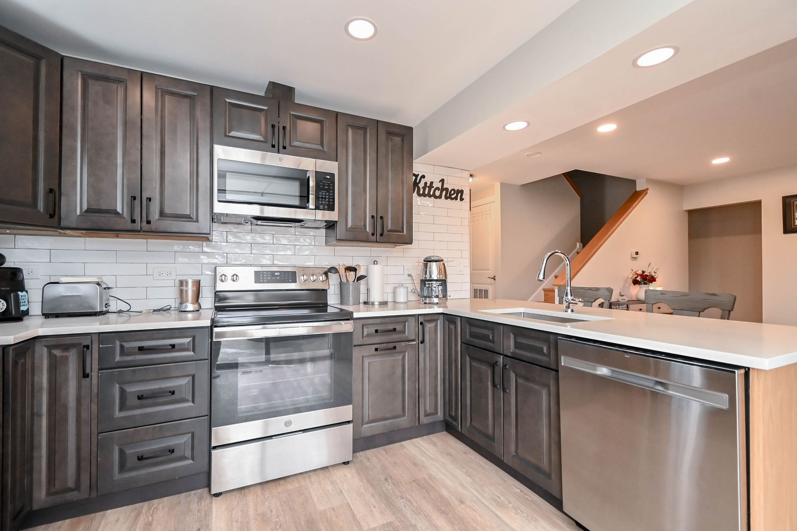 598 Dunham Road Gurnee, IL 60031 - Photo 8 of 31 a kitchen with a sink stove and microwave