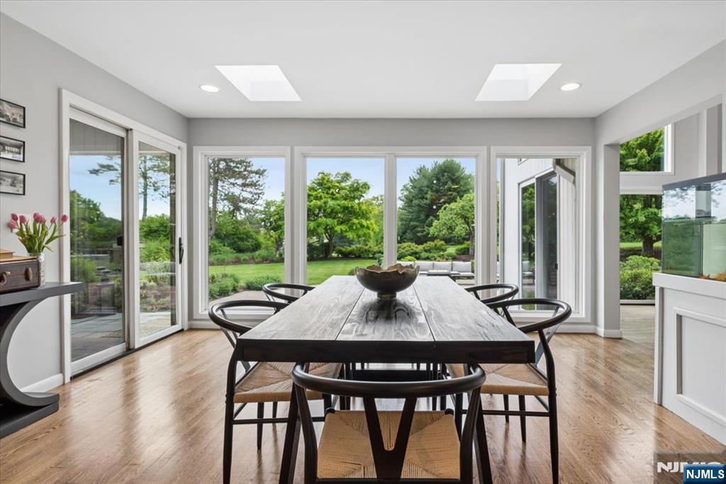 39 Eagle Nest Road Morris Township, NJ 07960 - Photo 19 of 43 a view of a dining room with furniture window and wooden floor