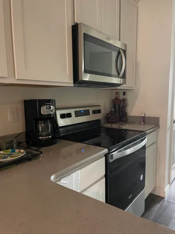 a swimming pool with outdoor seating and yard