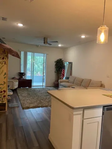 a living room with furniture and flowers