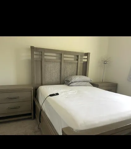 a black and white photo of a bedroom