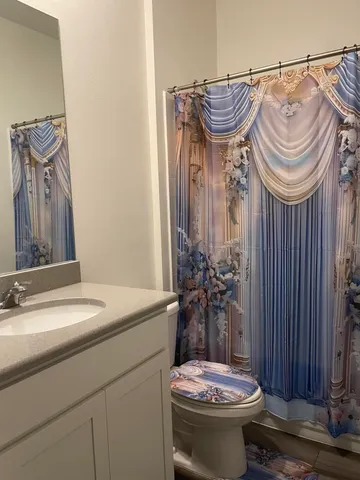 a kitchen with granite countertop a stove and a microwave