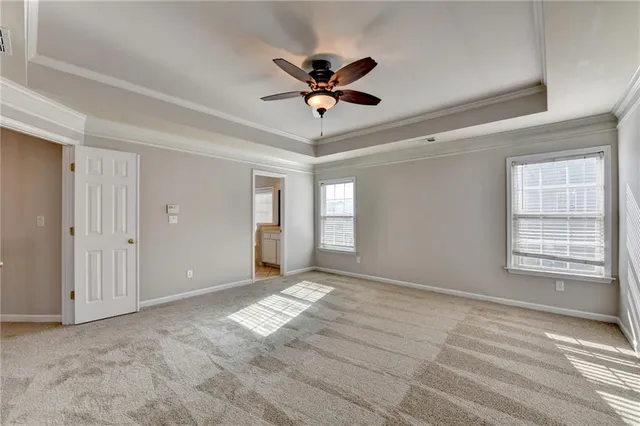 a view of a livingroom with a ceiling fan and window