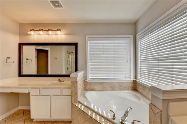 a bathroom with a bathtub and a sink