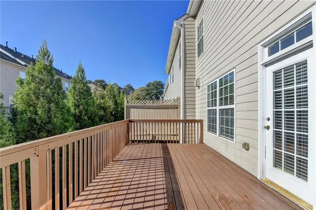 a view of a balcony with wooden floor