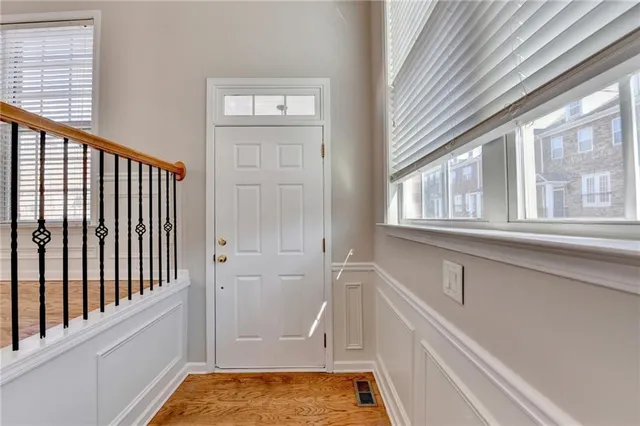 a bathroom with a tub and a window
