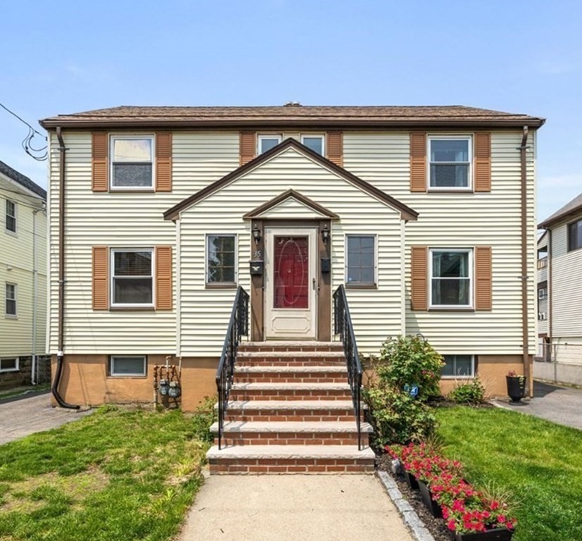 33 Bromfield Street, Unit 33 Watertown, MA 02472 - Photo 1 of 21 a front view of a house with a yard
