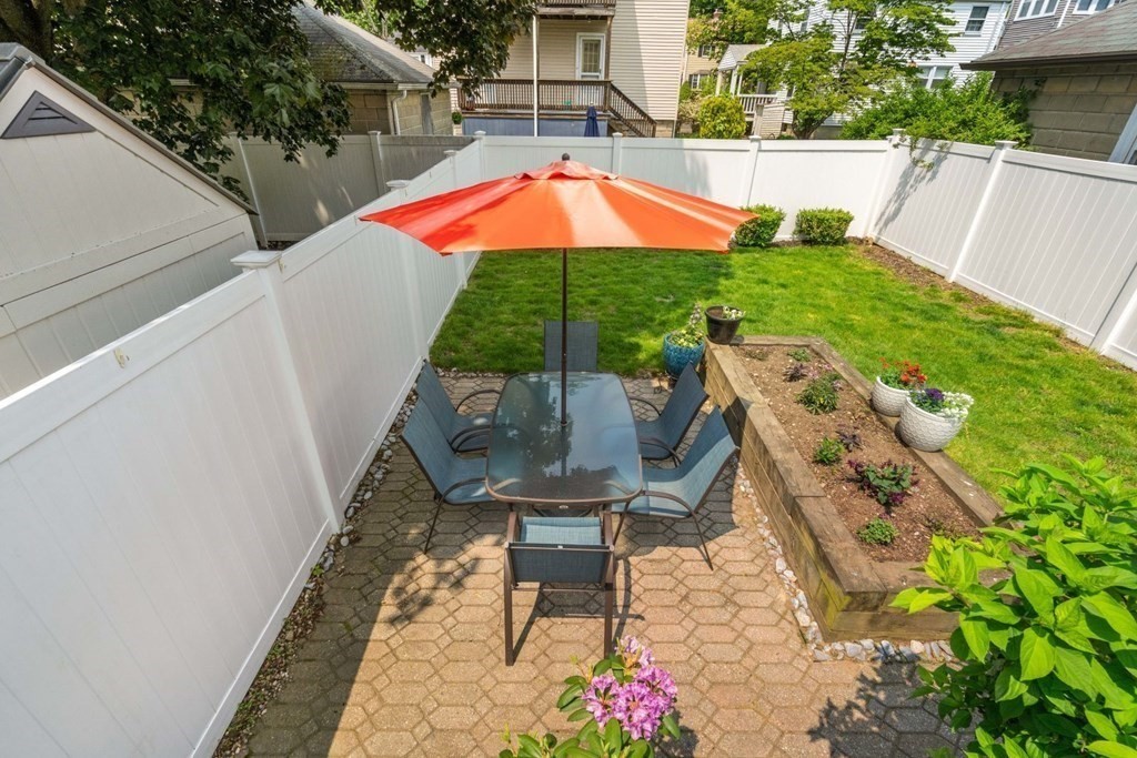 33 Bromfield Street, Unit 33 Watertown, MA 02472 - Photo 19 of 21 a view of outdoor space yard deck patio and outdoor kitchen