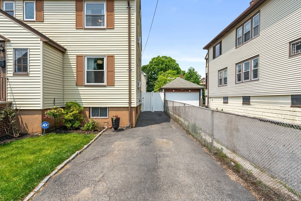 33 Bromfield Street, Unit 33 Watertown, MA 02472 - Photo 21 of 21 a view of a house with a yard and sitting area
