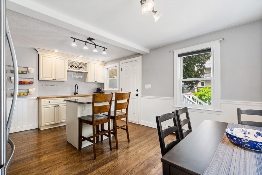 33 Bromfield Street, Unit 33 Watertown, MA 02472 - Photo 6 of 21 a view of a dining room with furniture and wooden floor