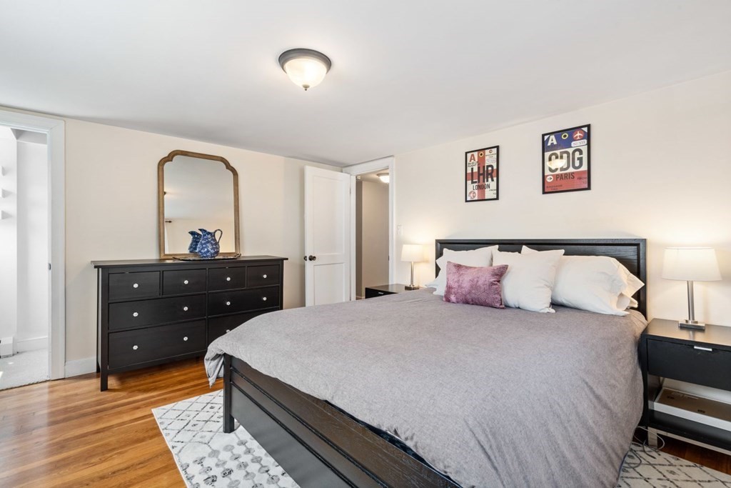 33 Bromfield Street, Unit 33 Watertown, MA 02472 - Photo 8 of 21 a bedroom with a bed and a dresser