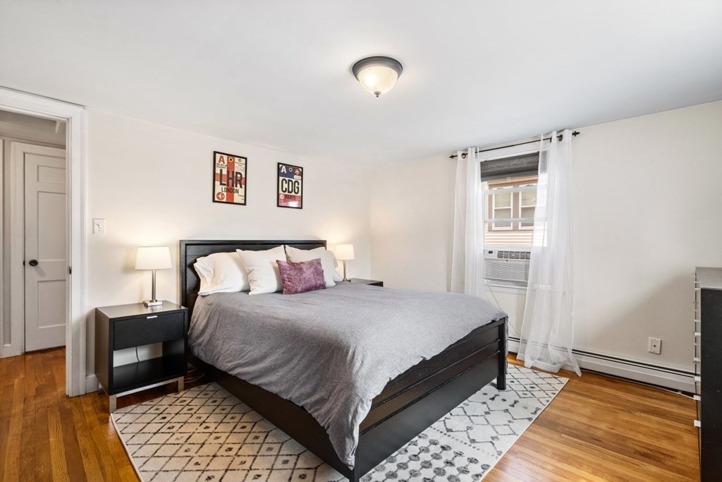 33 Bromfield Street, Unit 33 Watertown, MA 02472 - Photo 9 of 21 a bedroom with a bed and a couch