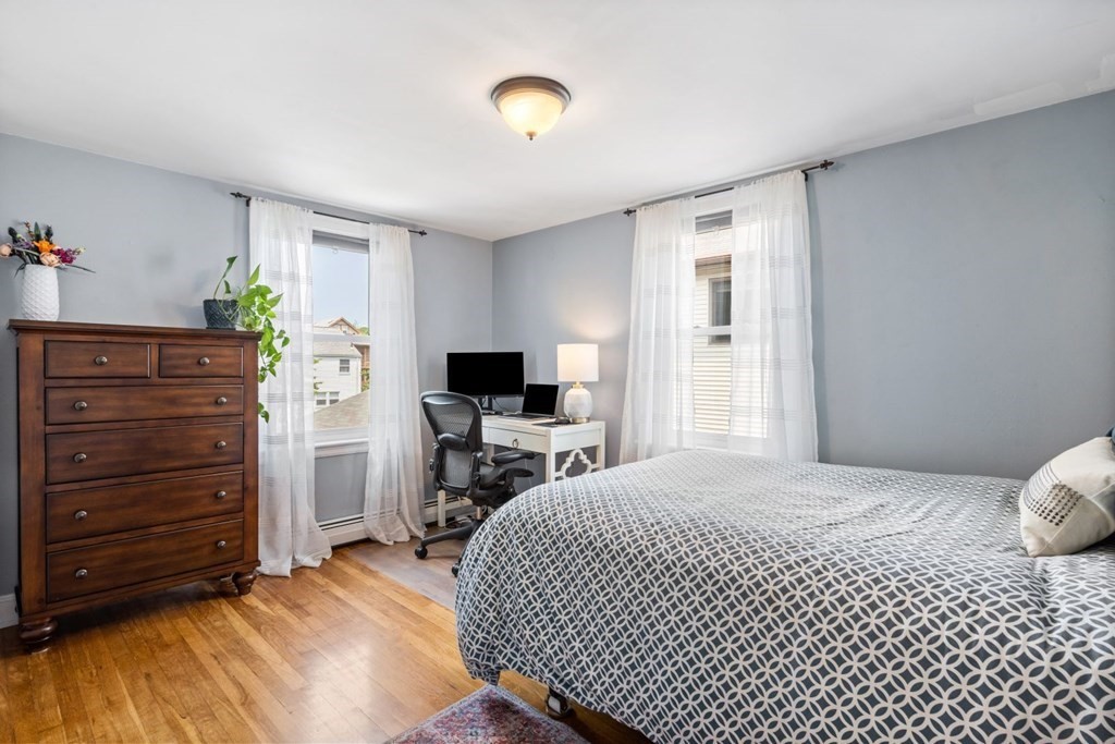 33 Bromfield Street, Unit 33 Watertown, MA 02472 - Photo 10 of 21 a bedroom with a bed and a television
