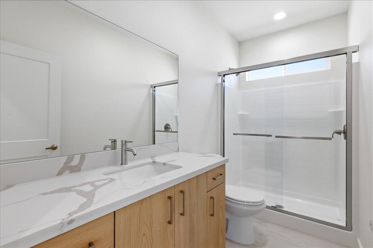 68160 Modalo Road Cathedral City, CA 92234 - Photo 53 of 57 a bathroom with a granite countertop sink mirror toilet and shower