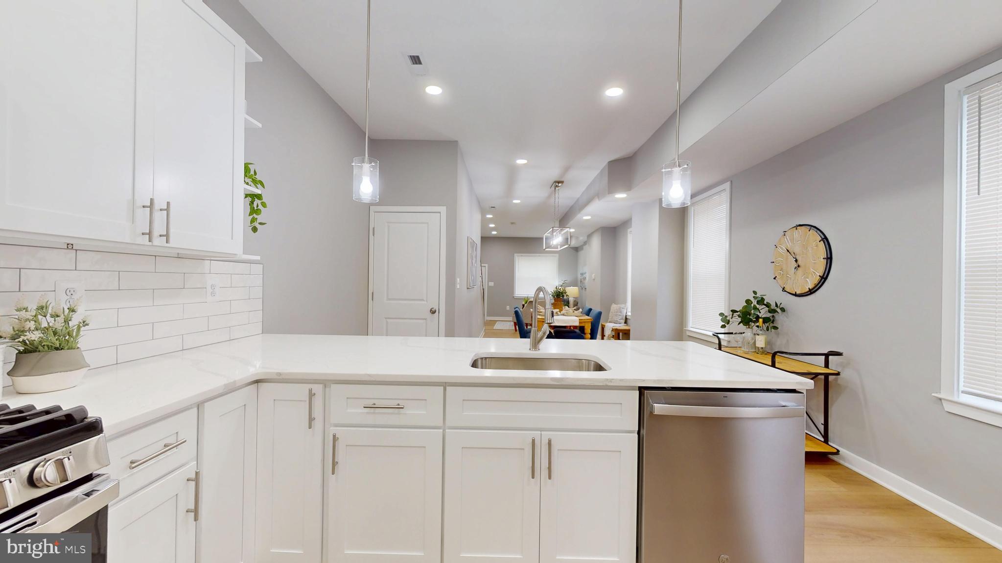 2519 East Fairmount Avenue Baltimore, MD 21224 - Photo 11 of 25 a view of a kitchen with kitchen island a sink stainless steel appliances and cabinets