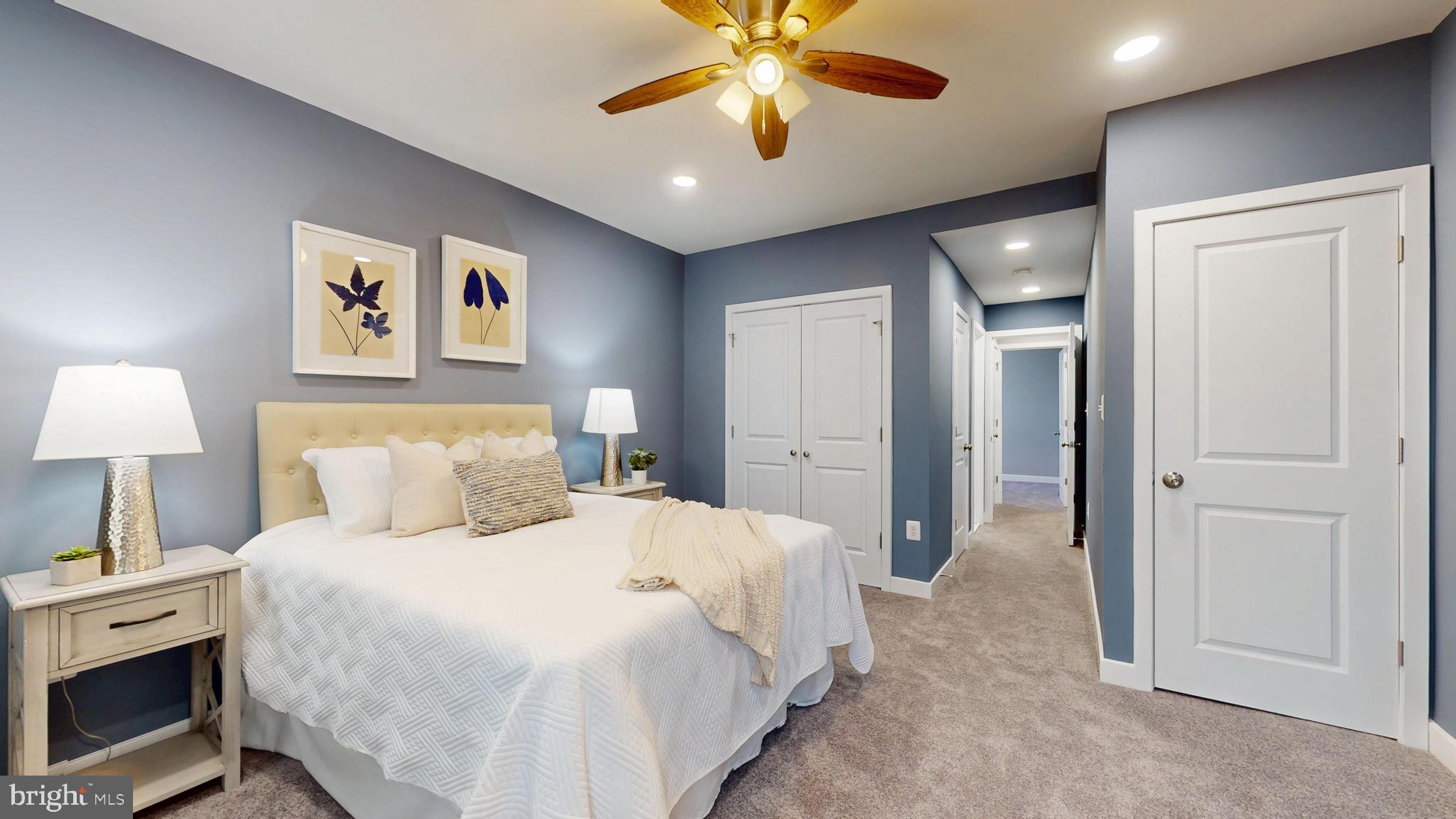 2519 East Fairmount Avenue Baltimore, MD 21224 - Photo 14 of 25 a bedroom with a bed and a chandelier